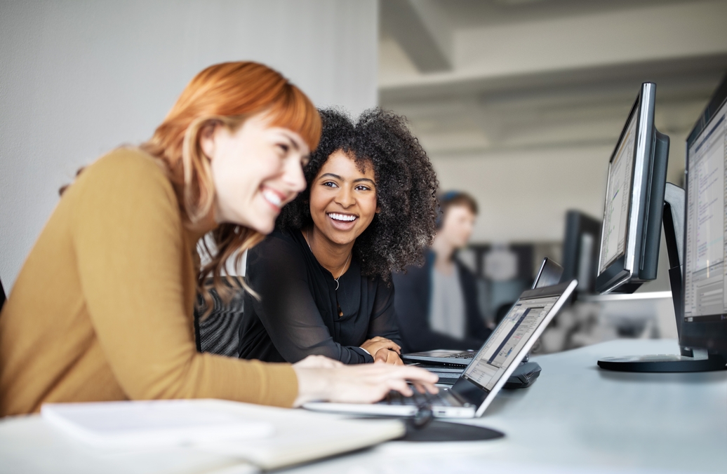 Two female colleagues in office working together